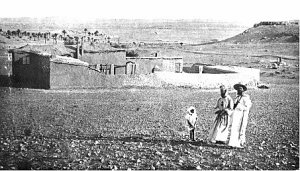 Blessed Charles de Foucauld with a little boy, Abd Jesus, whom he redeemed from slavery and his friend Father Charles Guérin, Apostolic Prefect of the Sahara