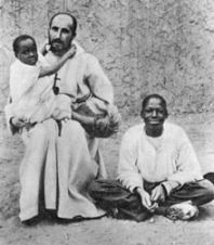 Charles de Foucauld and two slaves he freed