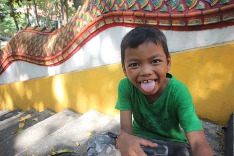 A new friend at Wat Thammanimit in Chonburi, Thailand